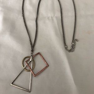 A long brushed silver geometric necklace
